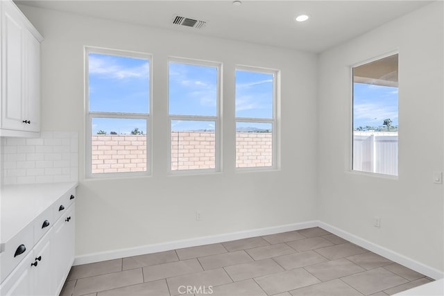 7444 Desert Sky Dr, Yucca Valley, CA 92284 - unfurnished dining area featuring healthy amount of natural light and recessed lighting