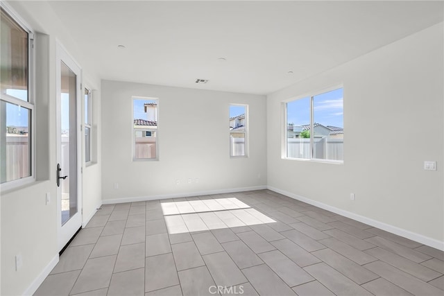 7444 Desert Sky Dr, Yucca Valley, CA 92284 - spare room with plenty of natural light and light tile patterned flooring