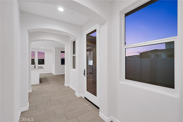 7444 Desert Sky Dr, Yucca Valley, CA 92284 - hallway featuring arched walkways, recessed lighting, and tile patterned flooring