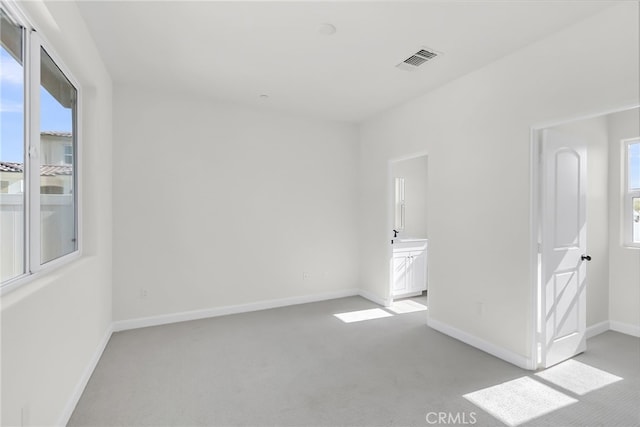 7444 Desert Sky Dr, Yucca Valley, CA 92284 - spare room with light colored carpet and baseboards