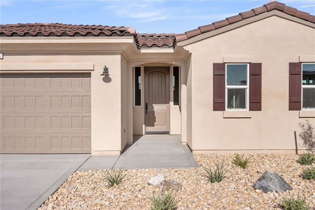 7444 Desert Sky Dr, Yucca Valley, CA 92284 - doorway to property with stucco siding and a tile roof