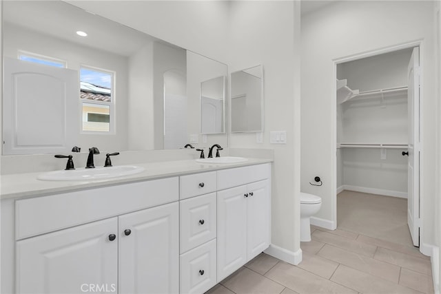 7444 Desert Sky Dr, Yucca Valley, CA 92284 - full bath with double vanity, a walk in closet, and tile patterned floors