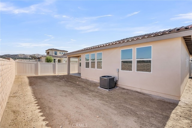 7444 Desert Sky Dr, Yucca Valley, CA 92284 - back of property featuring stucco siding, a fenced backyard, and a tile roof
