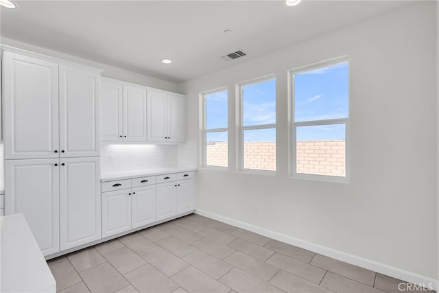 7444 Desert Sky Dr, Yucca Valley, CA 92284 - unfurnished dining area with baseboards and recessed lighting