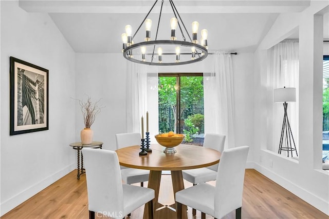 1059 Hillview Cir, Simi Valley, CA 93065 - dining area featuring a chandelier, light wood finished floors, and vaulted ceiling