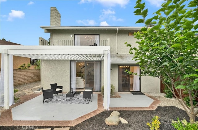 1059 Hillview Cir, Simi Valley, CA 93065 - rear view of property with a balcony, stucco siding, and a patio area