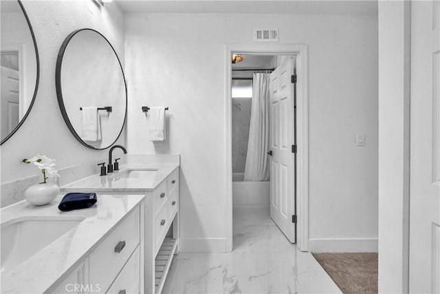 1059 Hillview Cir, Simi Valley, CA 93065 - bathroom featuring double vanity, marble finish floors, and shower / bath combo