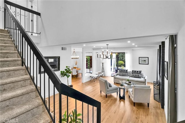 1059 Hillview Cir, Simi Valley, CA 93065 - living room with a chandelier, light wood-style floors, stairs, and recessed lighting
