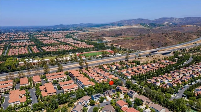 103 Sabiosa, Irvine, CA 92618 - aerial overview of property's location with a mountain backdrop and nearby suburban area