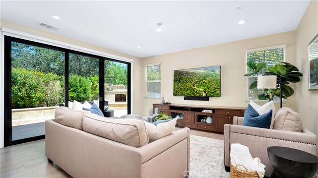 103 Sabiosa, Irvine, CA 92618 - living area with healthy amount of natural light, light wood finished floors, and recessed lighting