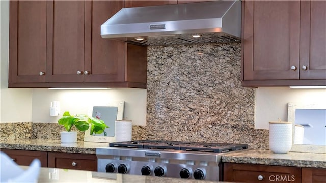 103 Sabiosa, Irvine, CA 92618 - kitchen with wall chimney exhaust hood, stainless steel gas stovetop, tasteful backsplash, and light stone counters