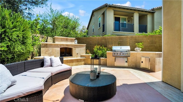 103 Sabiosa, Irvine, CA 92618 - view of patio with exterior kitchen and an outdoor living space with a fireplace