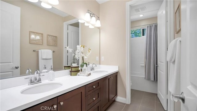 103 Sabiosa, Irvine, CA 92618 - full bath with double vanity, tile patterned floors, and shower / bath combo with shower curtain