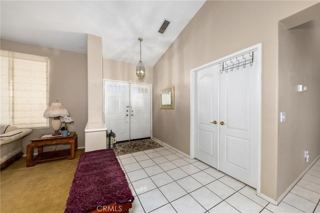 13161 Mugu Ct, Apple Valley, CA 92308 - foyer entrance featuring light tile patterned floors and high vaulted ceiling