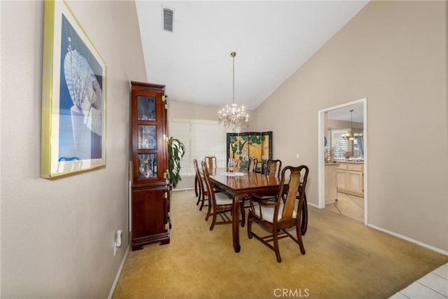 13161 Mugu Ct, Apple Valley, CA 92308 - carpeted dining area featuring a chandelier and high vaulted ceiling