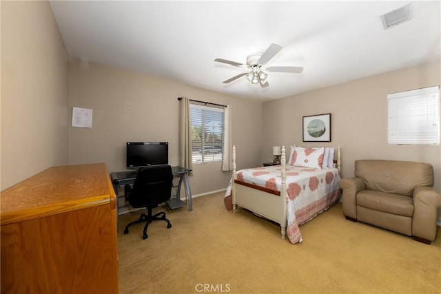13161 Mugu Ct, Apple Valley, CA 92308 - bedroom with light carpet, a desk, and ceiling fan