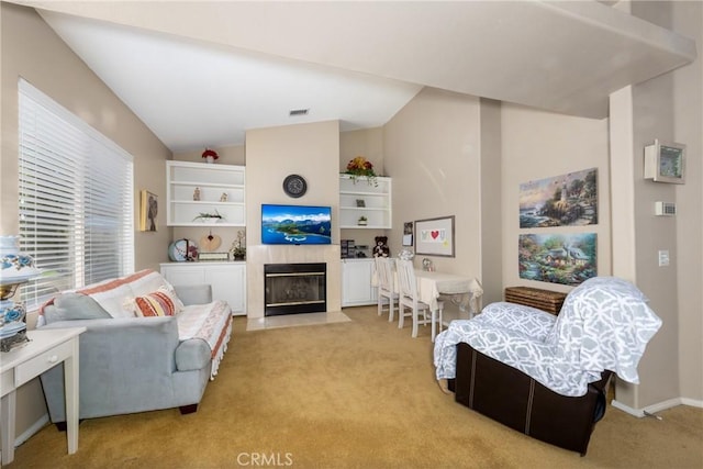 13161 Mugu Ct, Apple Valley, CA 92308 - living room featuring light colored carpet, lofted ceiling, and a tile fireplace