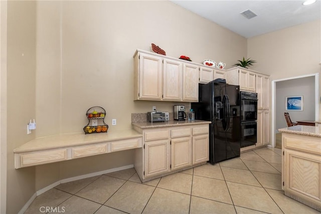 13161 Mugu Ct, Apple Valley, CA 92308 - kitchen featuring black appliances, light tile patterned floors, and light countertops