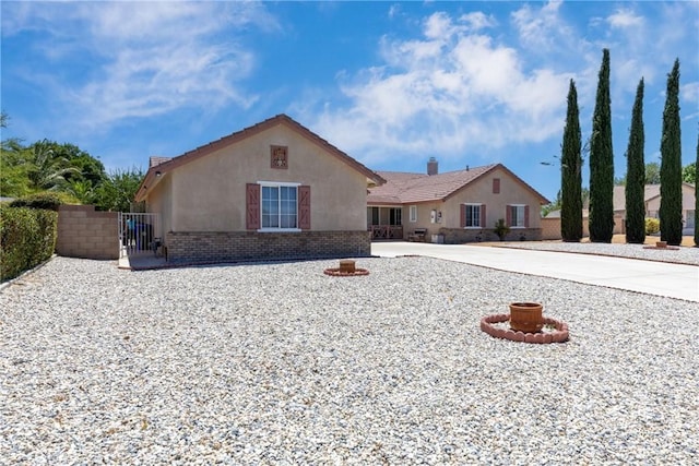 13161 Mugu Ct, Apple Valley, CA 92308 - view of front of house featuring stucco siding, driveway, a gate, and brick siding