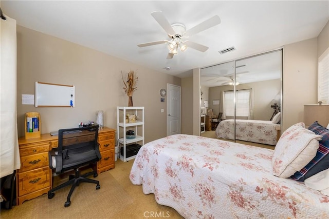 13161 Mugu Ct, Apple Valley, CA 92308 - bedroom featuring light carpet, a closet, and a ceiling fan