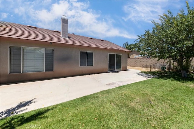 13161 Mugu Ct, Apple Valley, CA 92308 - rear view of house with a patio area, stucco siding, a chimney, and a tile roof