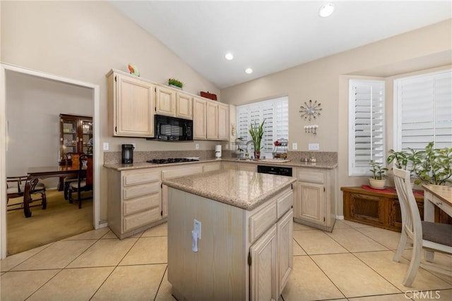 13161 Mugu Ct, Apple Valley, CA 92308 - kitchen featuring black microwave, light tile patterned flooring, a kitchen island, vaulted ceiling, and recessed lighting