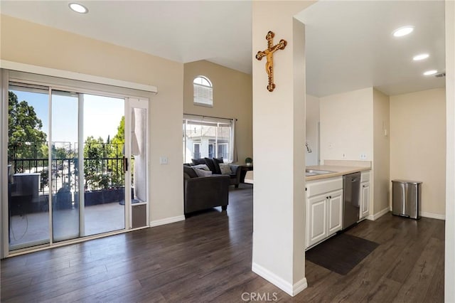 20000 Plum Canyon Rd Unit 1827, Saugus, CA 91350 - kitchen with stainless steel dishwasher, dark wood-type flooring, white cabinets, light countertops, and recessed lighting