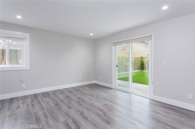 783 E Grand Ave, Pomona, CA 91766 - unfurnished room with healthy amount of natural light, recessed lighting, and wood finished floors