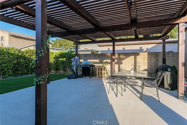 783 E Grand Ave, Pomona, CA 91766 - fenced backyard with area for grilling, a pergola, outdoor dining area, and a patio area