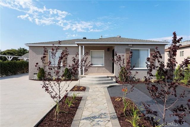 783 E Grand Ave, Pomona, CA 91766 - single story home with stucco siding and a porch