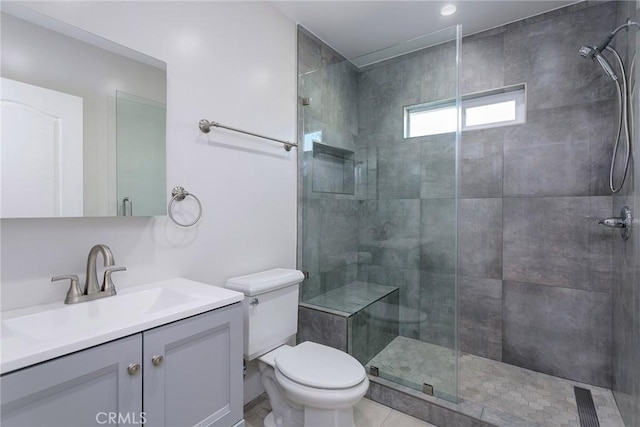 783 E Grand Ave, Pomona, CA 91766 - bathroom featuring a tile shower, vanity, and tile patterned flooring