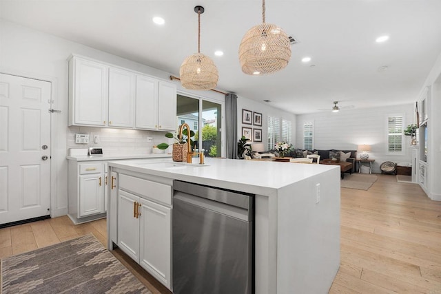 17236 Eagle Canyon Way, San Diego, CA 92127 - kitchen featuring dishwasher, light countertops, a ceiling fan, white cabinetry, and light wood-style flooring