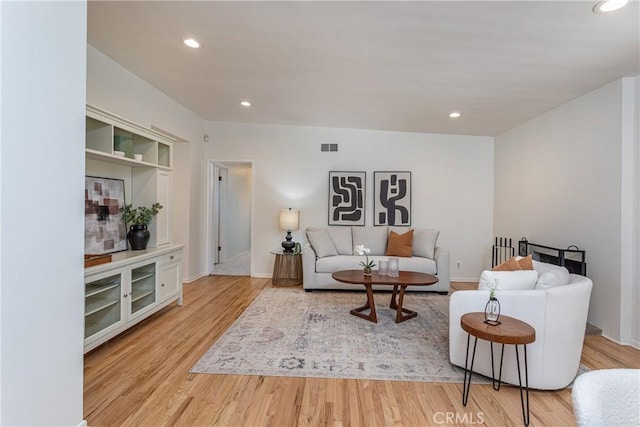 15713 Tuba St, North Hills, CA 91343 - living room featuring wood finished floors and recessed lighting