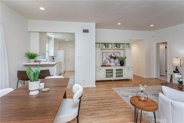 15713 Tuba St, North Hills, CA 91343 - living room featuring light wood finished floors and recessed lighting