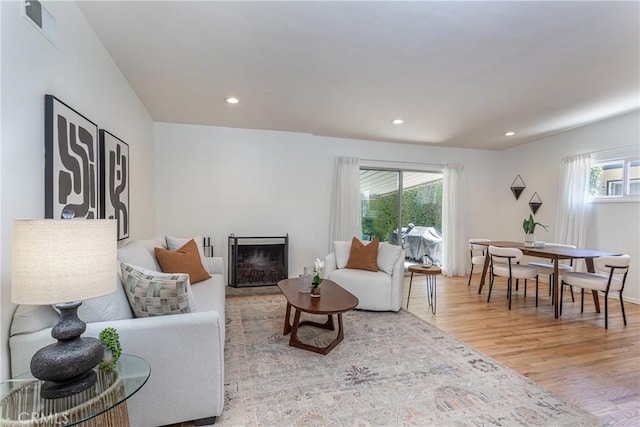 15713 Tuba St, North Hills, CA 91343 - living area featuring light wood finished floors, recessed lighting, and a fireplace