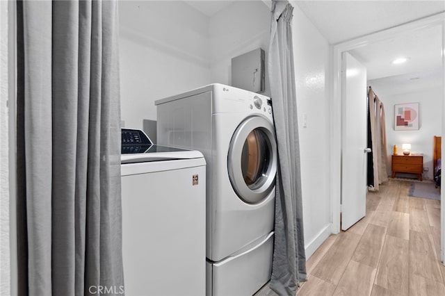 1110 Ohio Ave Unit 107, Long Beach, CA 90804 - laundry area featuring washing machine and dryer, light wood-style flooring, and recessed lighting