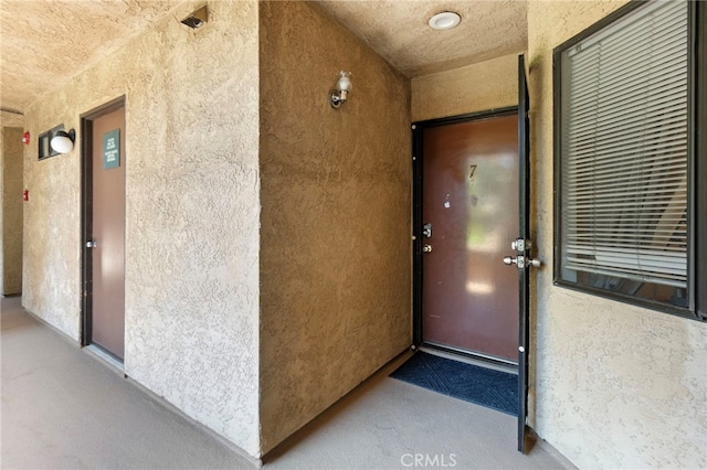 1110 Ohio Ave Unit 107, Long Beach, CA 90804 - doorway to property featuring stucco siding