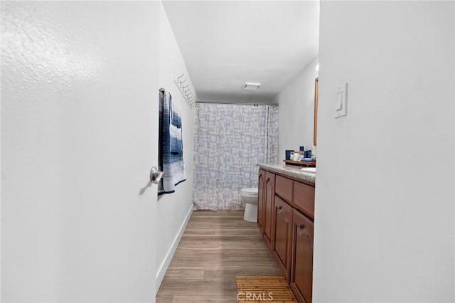 1110 Ohio Ave Unit 107, Long Beach, CA 90804 - full bathroom featuring vanity, a shower with shower curtain, and wood finished floors