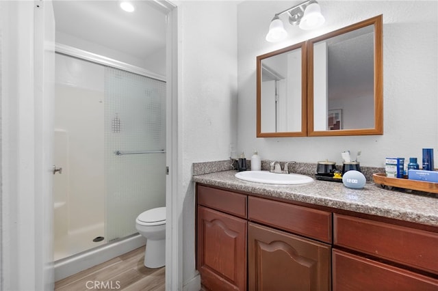 1110 Ohio Ave Unit 107, Long Beach, CA 90804 - full bath featuring vanity, a shower stall, and wood finished floors