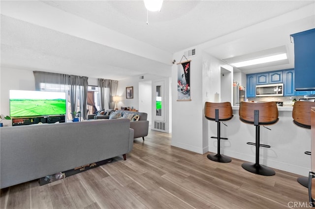 1110 Ohio Ave Unit 107, Long Beach, CA 90804 - living area featuring light wood finished floors