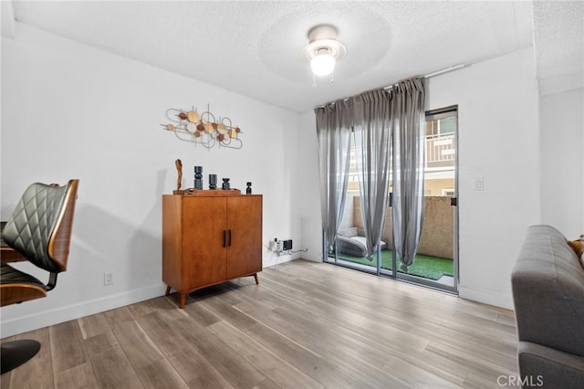 1110 Ohio Ave Unit 107, Long Beach, CA 90804 - home office with a textured ceiling, wood finished floors, and a ceiling fan