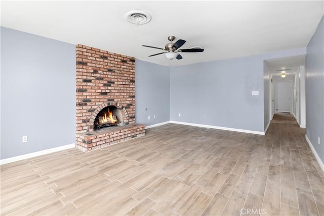 42397 Santiago Dr, Hemet, CA 92544 - unfurnished living room featuring a ceiling fan, wood finished floors, and a brick fireplace