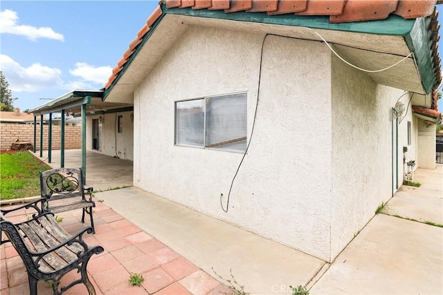 42397 Santiago Dr, Hemet, CA 92544 - view of home's exterior featuring a patio area, stucco siding, and a tile roof