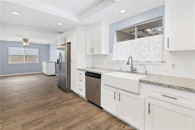 42397 Santiago Dr, Hemet, CA 92544 - kitchen featuring stainless steel appliances, white cabinets, backsplash, a ceiling fan, and recessed lighting