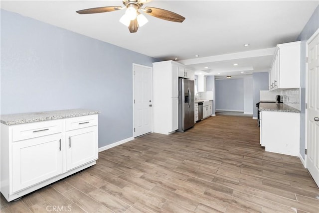 42397 Santiago Dr, Hemet, CA 92544 - kitchen featuring appliances with stainless steel finishes, a ceiling fan, light wood-type flooring, white cabinets, and recessed lighting