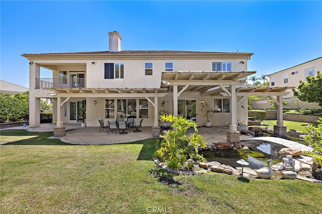 2189 Wind River Ln, Rowland Heights, CA 91748 - back of house with a pergola, a balcony, a chimney, a lawn, and stucco siding