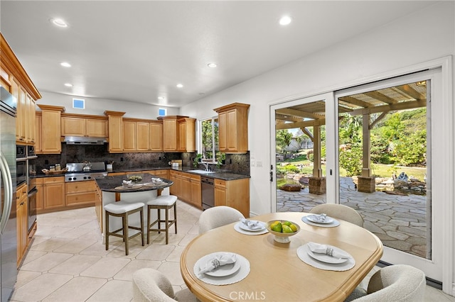 2189 Wind River Ln, Rowland Heights, CA 91748 - kitchen with stainless steel appliances, backsplash, a kitchen island, under cabinet range hood, and recessed lighting