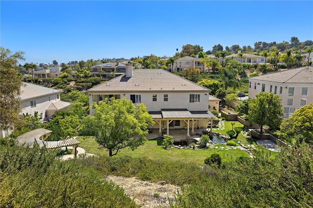 2189 Wind River Ln, Rowland Heights, CA 91748 - rear view of house with a chimney, stucco siding, a residential view, and a patio area