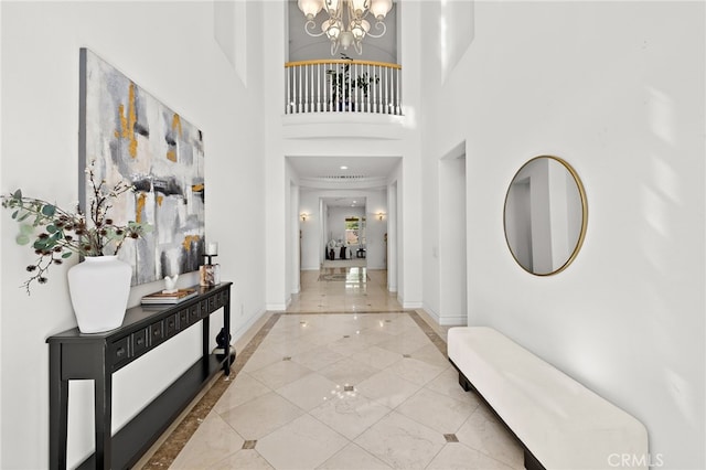 2189 Wind River Ln, Rowland Heights, CA 91748 - foyer entrance featuring inlaid floor details, a chandelier, and a towering ceiling