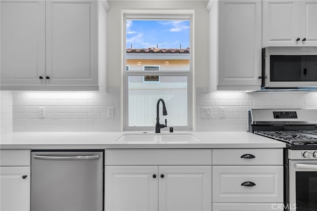 7432 Desert Sky Dr, Yucca Valley, CA 92284 - kitchen featuring stainless steel appliances, white cabinetry, tasteful backsplash, and light countertops